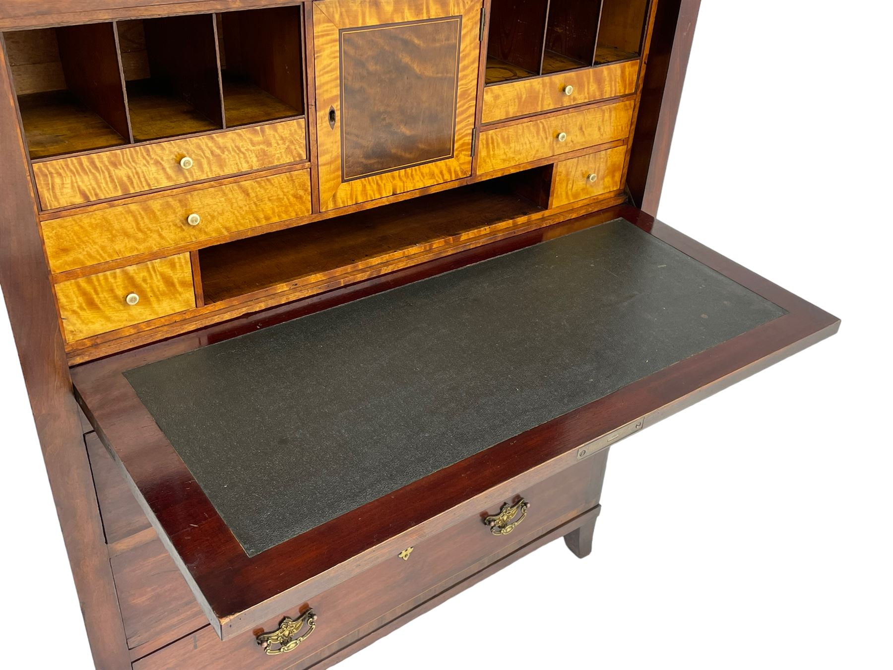 Early to mid-19th century figured mahogany Continental secrétaire à abattant, stepped top fitted with single cupboard, inlaid with oval figured amboyna panels, the fall front inlaid with shell motif enclosing a satinwood interior fitted with cupboard, drawers, and pigeon holes, three long drawers below, on square tapering feet