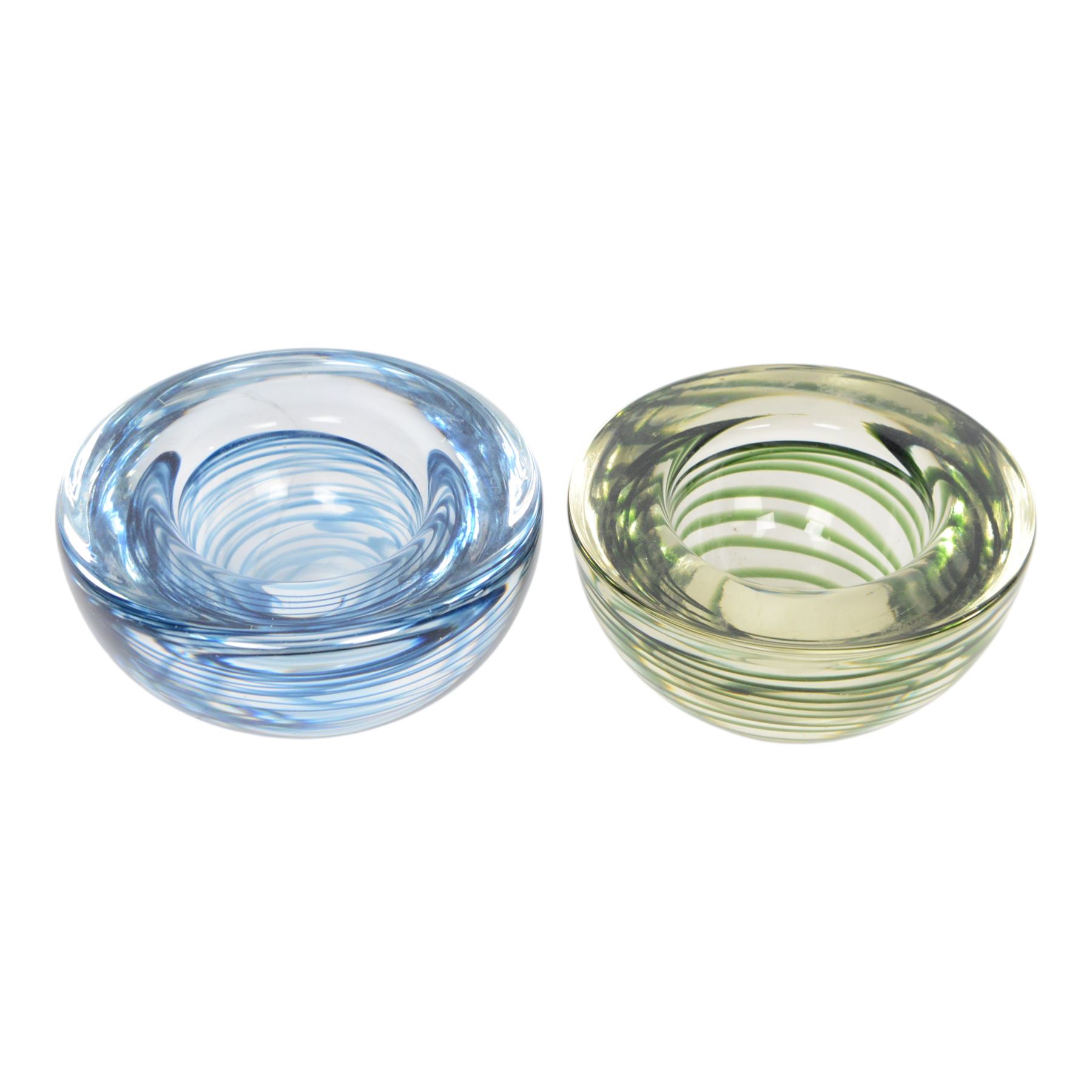 Three Kosta Boda glass bowls, together with four paperweights including an example by Marian Pyrcak