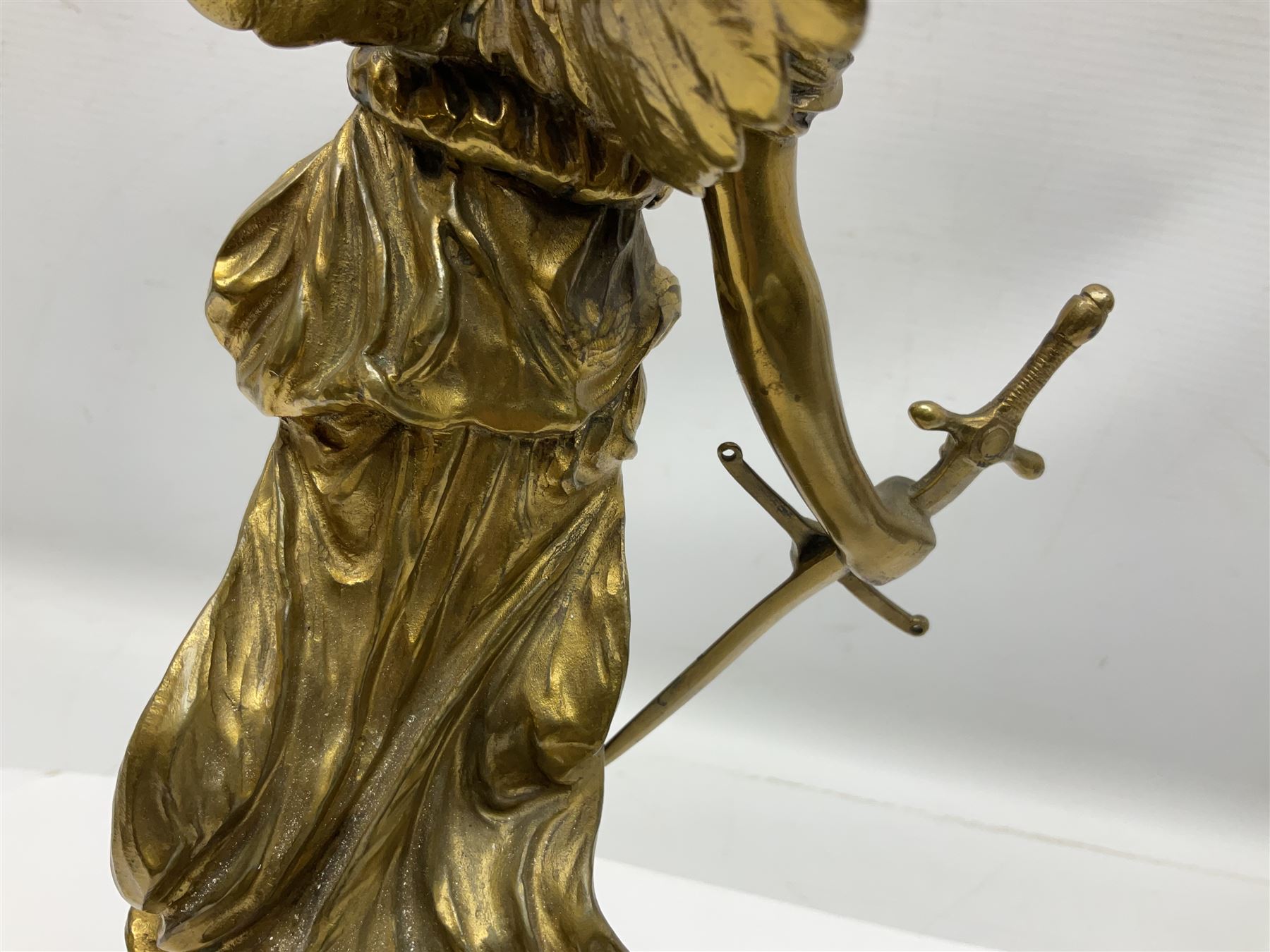 After Oswald Schimmelpfennig (German, 1872-1939): Pair of gilt bronze winged Allegorical female figures, the first example with arm outstretched holding a branch, signed 'Schimmelpfennig 1900', the second with arm raised above her head holding a book and sword in the other, both raised upon marble plinths, H45cm
