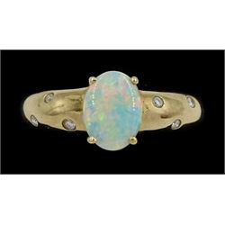 9ct gold opal ring, either side with three rubover set, round brilliant cut diamonds, Sheffield 2004