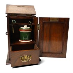 Edwardian oak smokers cabinet with carved panel door and hinged lid and a collection of various pipes and other items