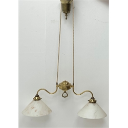  An early 20th century brass twin branch rise and fall light fitting, with opaque glass shades.   