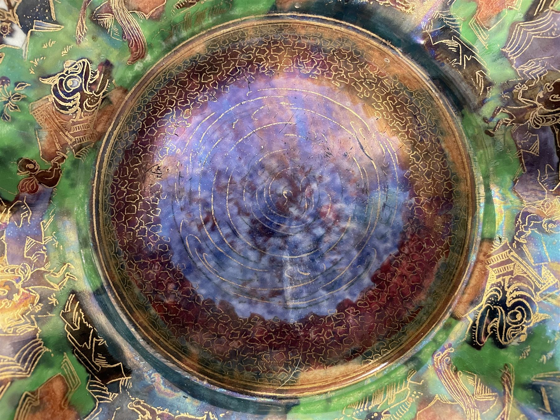 Early 20th century Wedgwood Fairland lustre bowl, circa 1920, of octagonal form, designed by Daisy Makeig-Jones, the exterior decorated in the Castle on the Road pattern, the interior decorated in the Fairy in a Cage pattern, pattern no Z5125, with printed marks beneath, H11cm D22.5cm
