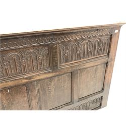 Jacobean style heavily carved oak panel headboard, projecting cornice