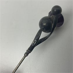 Silver hatpin modelled as a thistle, by Charles Horner, together with three other silver hatpins, modelled as a tennis racket, golf club and Medusa mask, all hallmarked 