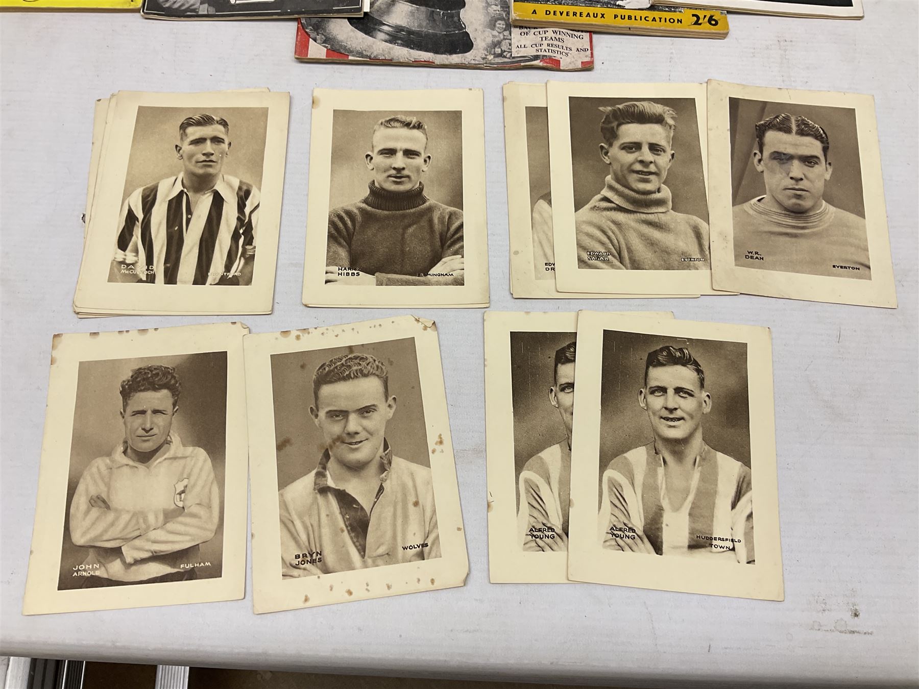 Football - Sherman's Searchlight on Famous Teams trade cards 1938-39 (28) and Searchlight on Famous Players (15); and nine booklets including F.A. Cup Annual 1951;two early 1960s F.A. Yearbooks etc; together with seven photographs of cricket teams, first half of 20th century; and four 1940s and later cricket booklets; and a signed postcard of boxer Len Harvey