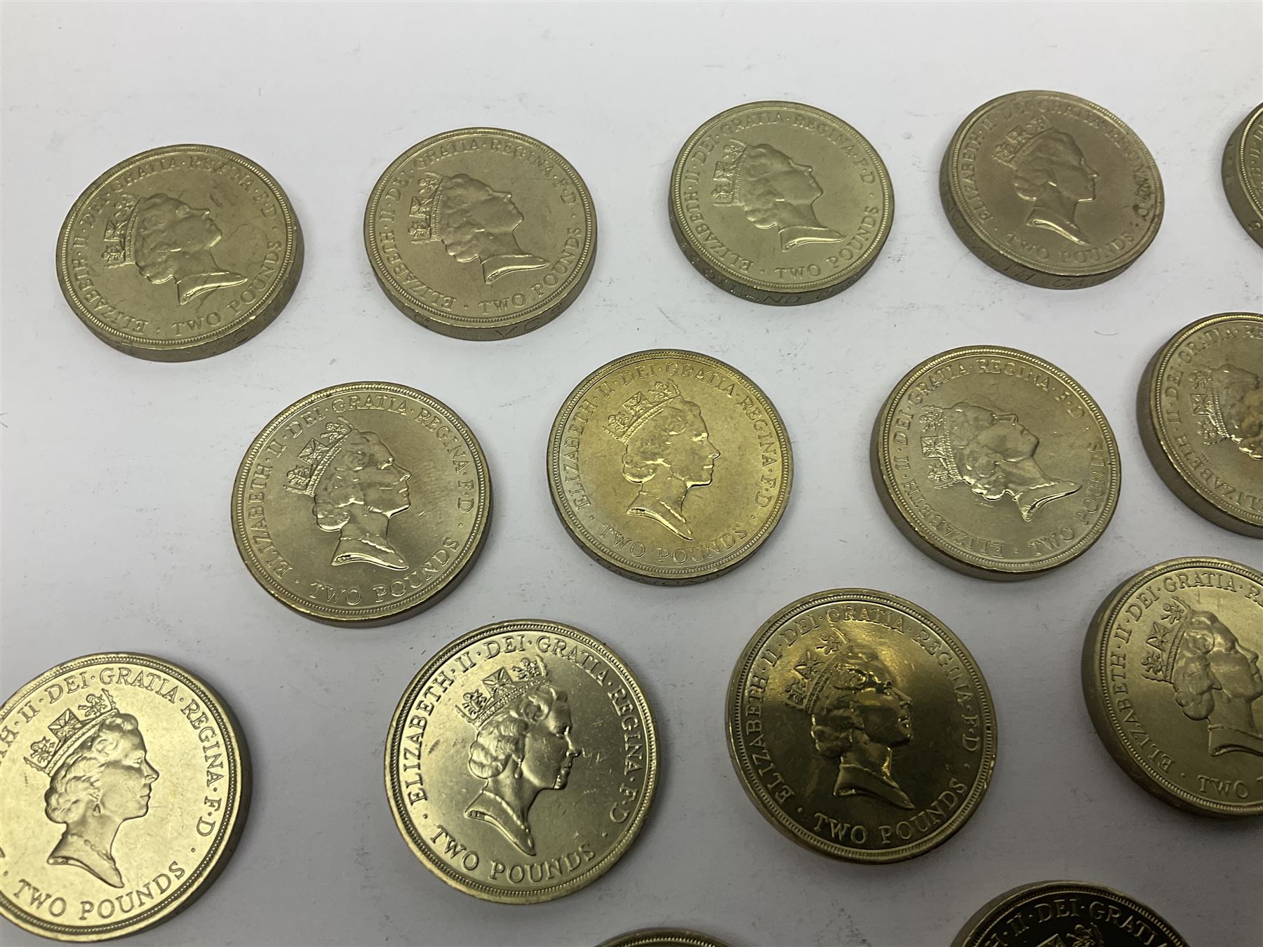 Twenty-eight Queen Elizabeth II old style two pound coins, including 1994 'Bank of England' etc