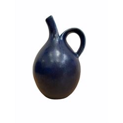 Saxbo blue glazed earthenware ewer designed by Eva Staehr Nielson (née Wilhelm), of bulbous form with strap handle and elongated spout, H19cm 
