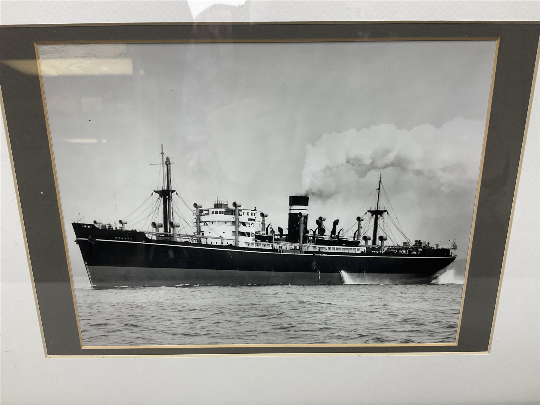 Set of twelve monochrome photographs of mid-20th century merchant vessels comprising general cargo ships, cargo liners, RMMV passenger cargo liners and hospital ship including Rowallan Castle, Drakensberg Castle, Stirling Castle, Capetown Castle, Pachumba, Tilapa etc; average size 18 x 24cm; uniformly mounted in black frames (12)