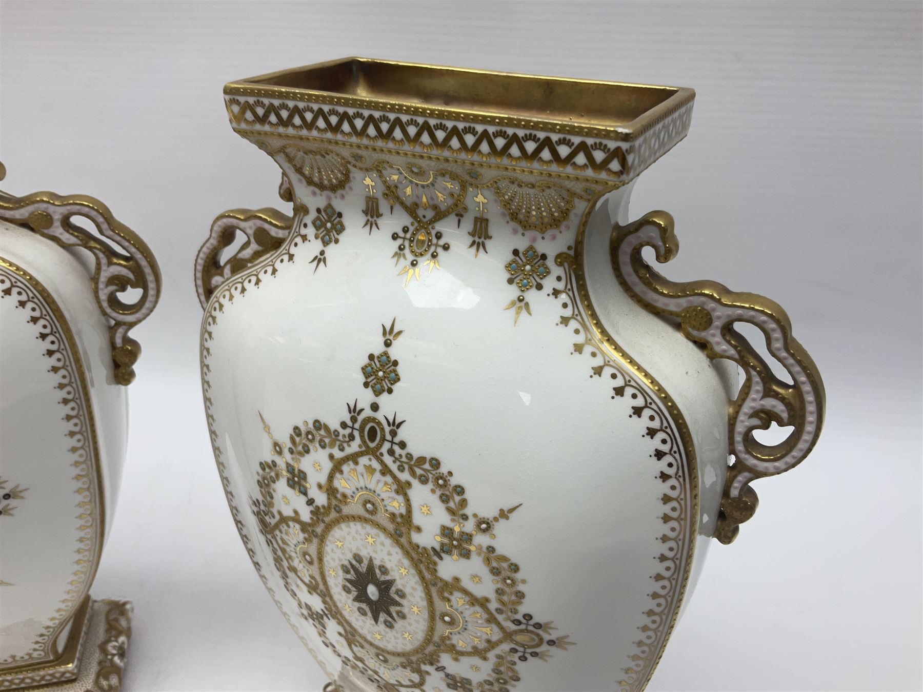 Pair of Copelands enamel jeweled twin handle vases, each decorated with a seated female figures, makers mark beneath, H22cm