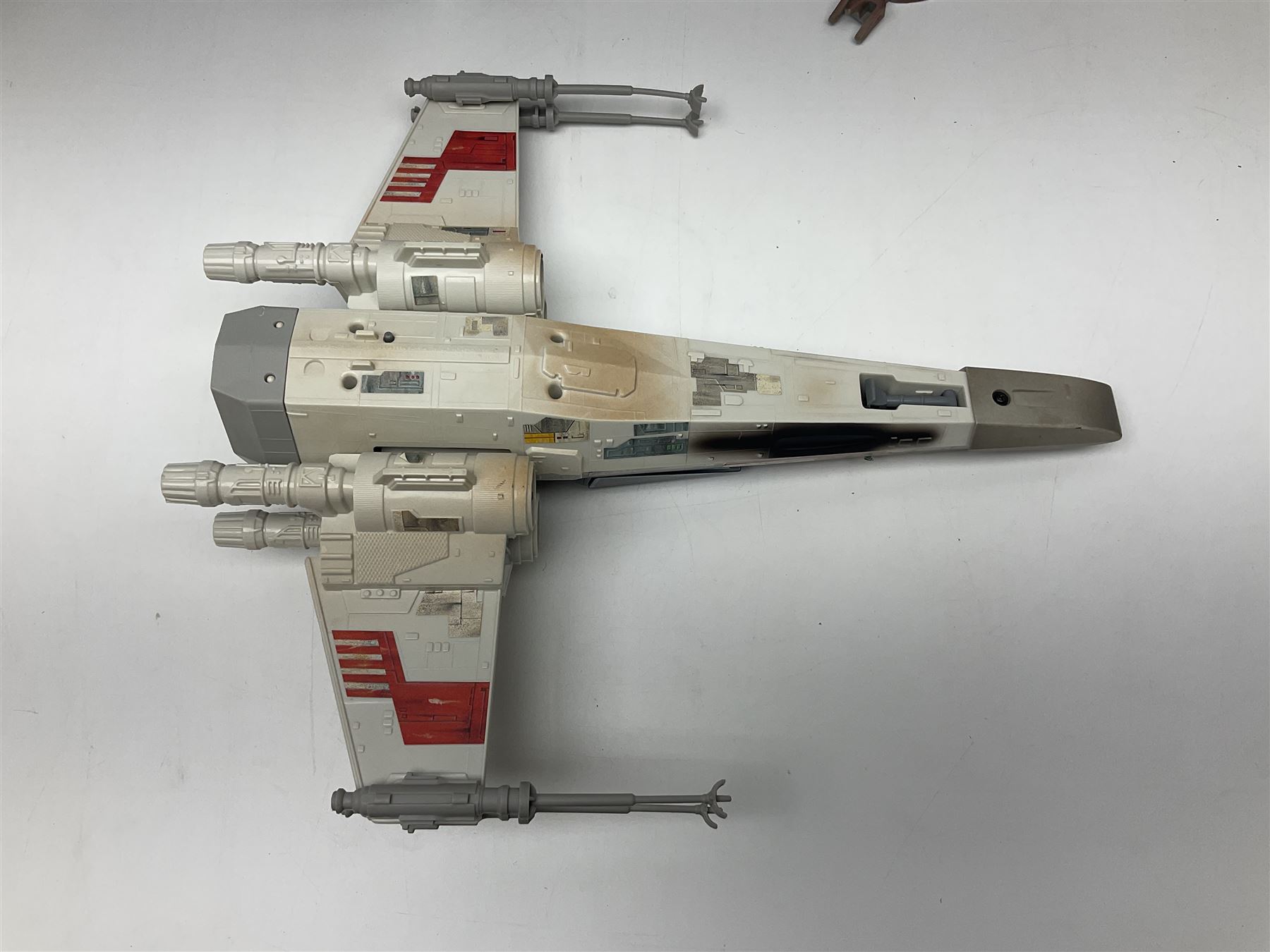 Star Wars - four space/land vehicles comprising Millenium Falcon with hinged top and figures; TIE Fighter; X-Wing Fighter with pilot; and AT-ST 'Chicken Walker' transporter; all unboxed (4)