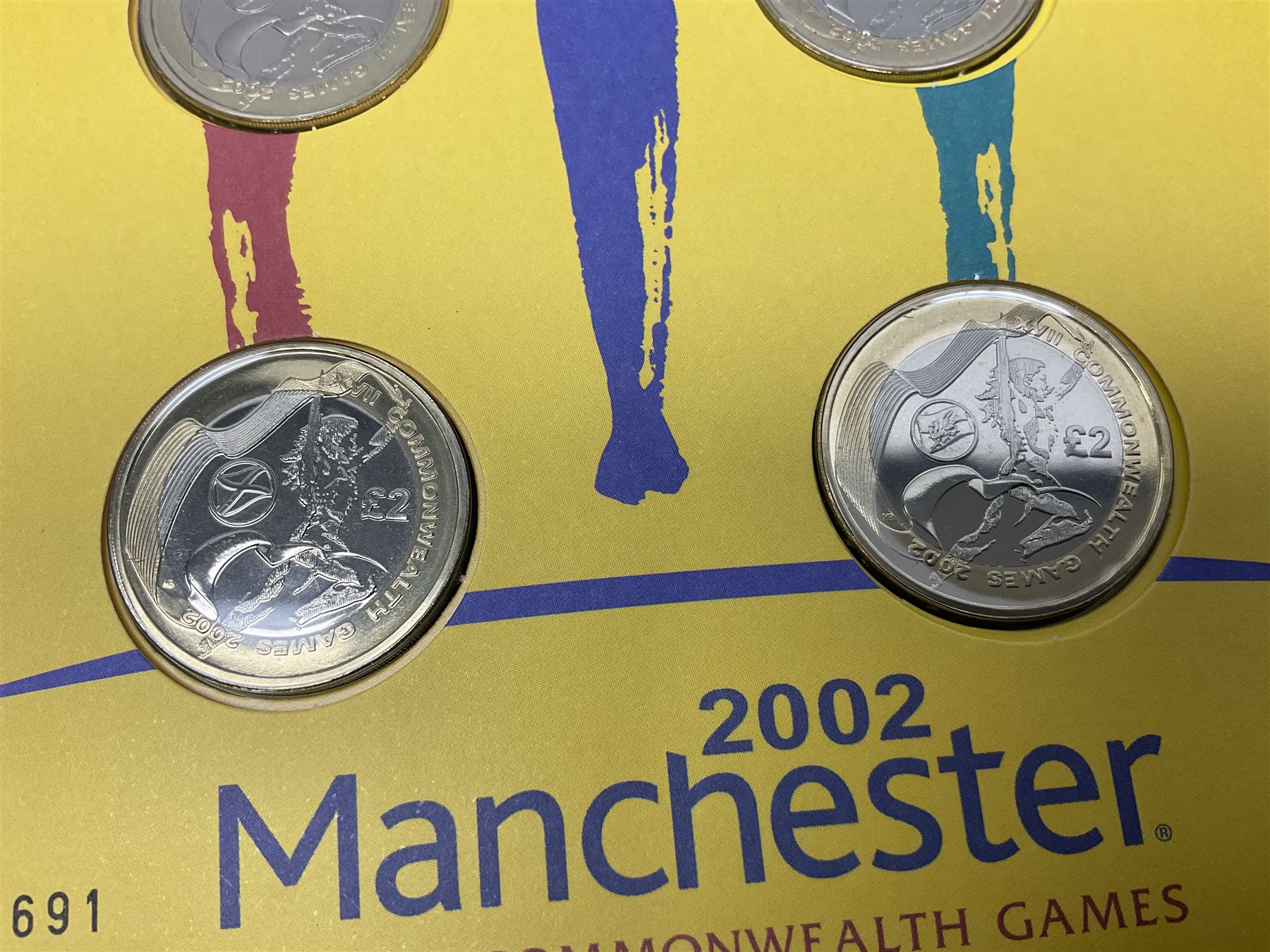 The Royal Mint Queen Elizabeth II 2002 Manchester Commonwealth Games four coin two pound coin cover