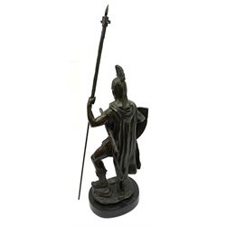 A bronzed figure modelled as a warrior, upon a marble base, overall H55cm. 