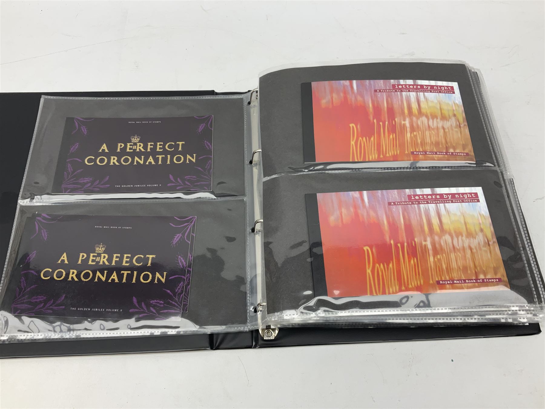 Seventy-five Royal Mail book of stamps, including 'The Story of Beatrix Potter', 'Microcosmos', 'Across The Universe', 'A Perfect Coronation', 'The Bronte Sisters', 'Battle of Trafalgar Death of Nelson' etc, housed in a ring binder album