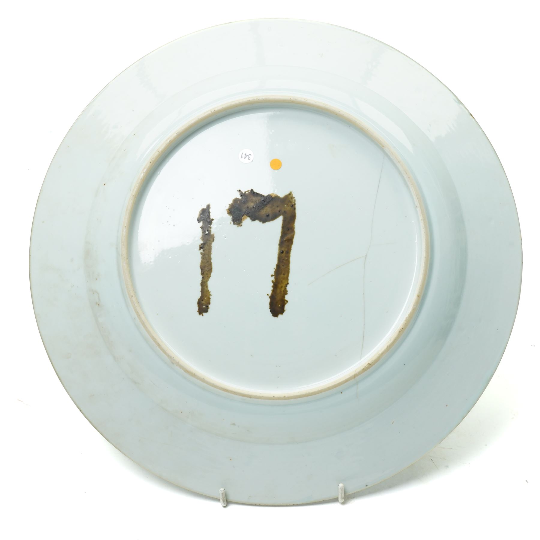 18th century Chinese oval dish shallow dish decorated with flowers in blue and white within a scroll and key pattern border W37cm and a Chinese blue and white charger D34cm (2)
