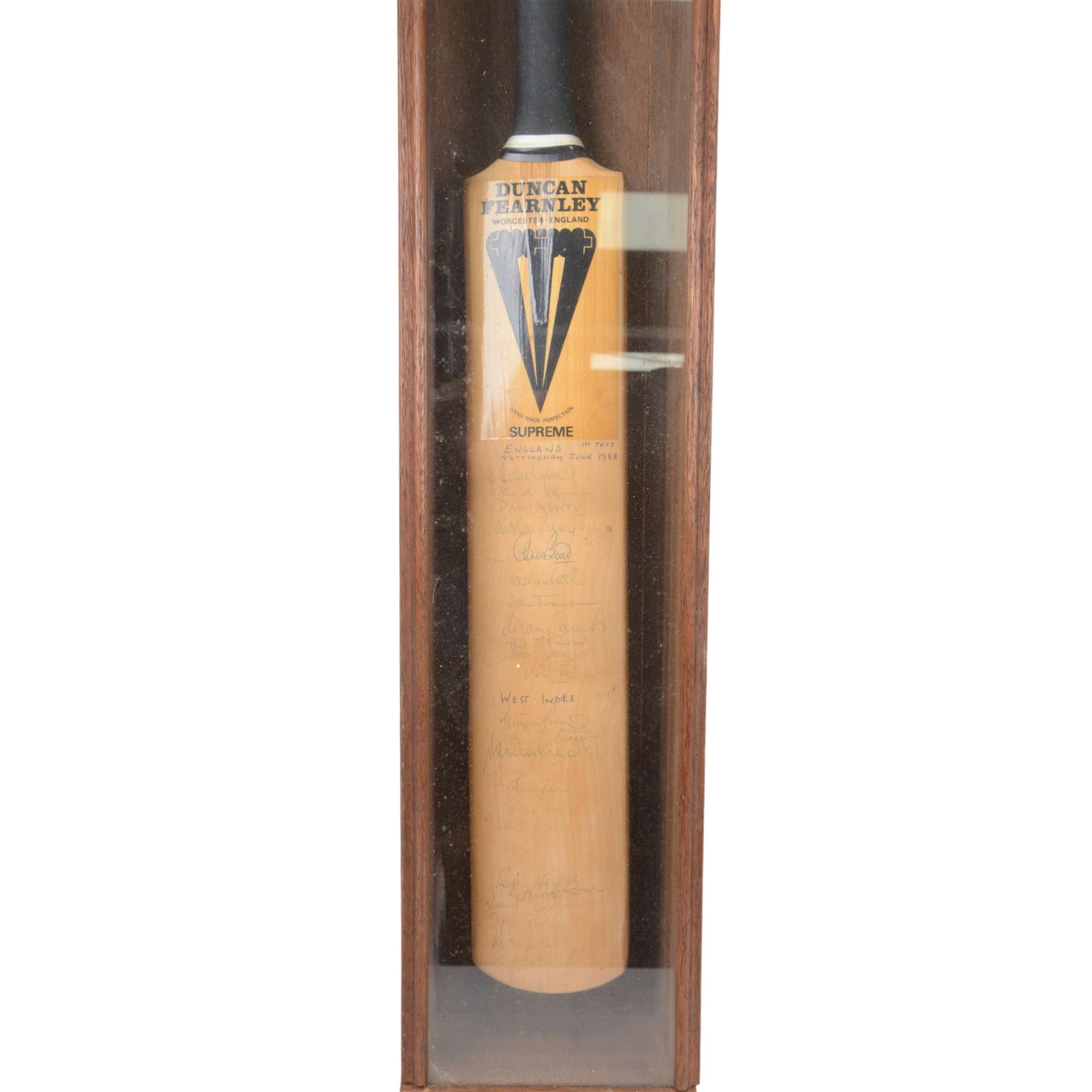 Duncan Fearnley cricket bat, signed by the 1988 England vs West Indies cricket teams from the 1st test match with players signatures including Mike Gatting, Allan Lamb, David Gower, Graham Gooch, Viv Richards and Curtly Ambrose, contained within a glazed wooden display case, H100cm