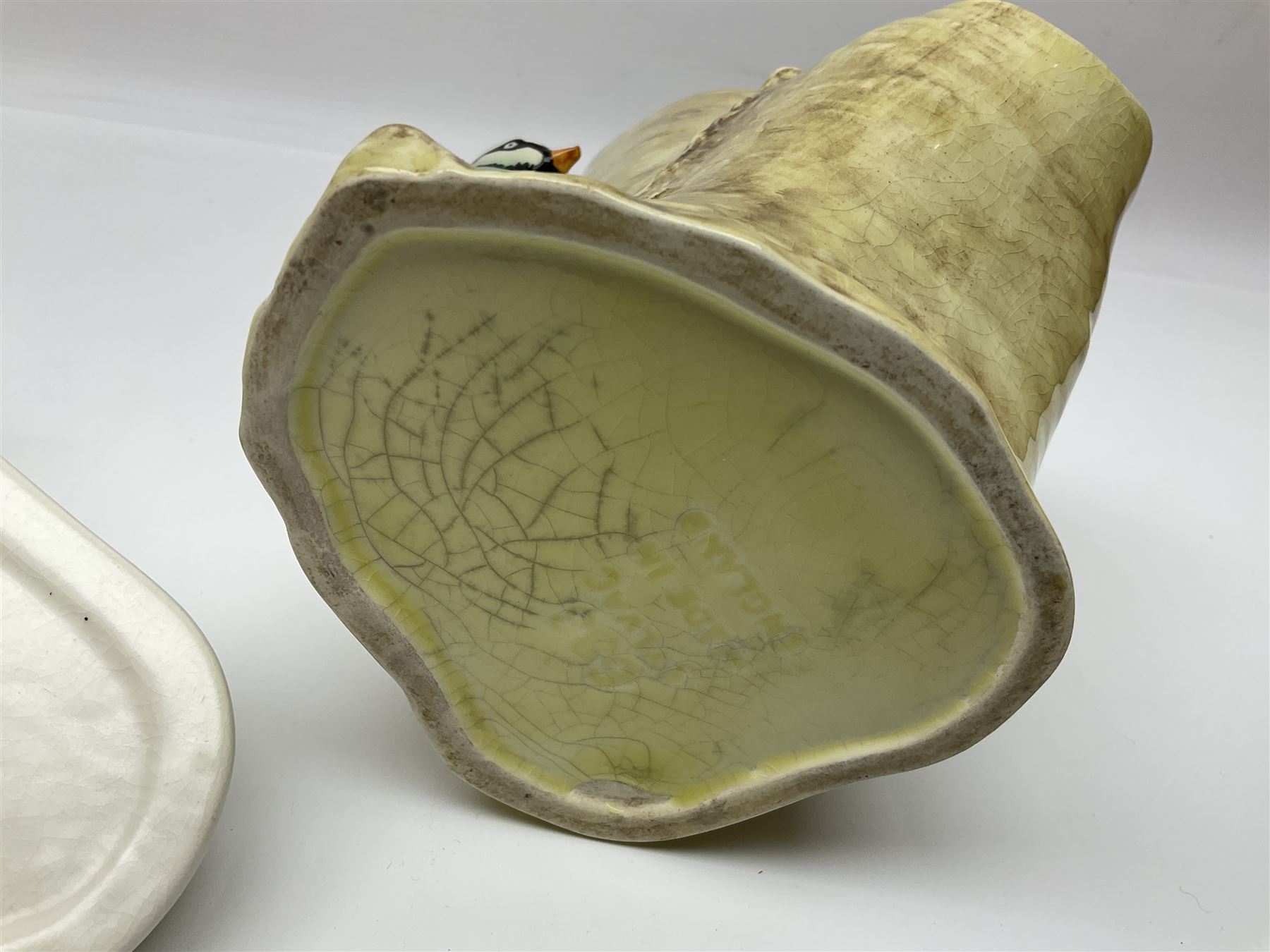 Sylvac budgieregar wall pocket, together with other Sylvac cermics including swan vases, blue tit vase and a frog figure etc, all with printed or impressed marks beneath, and a Poole Pottery cat figure, with printed mark beneath, wall pocket H22cm