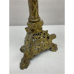 Pair of gilt metal pricket candlesticks, with applied decoration on knopt stems and triform bases, H47cm