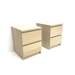 Pair Ikea light oak bedside chests, two drawers, plinth base, W41cm, H55cm, D49cm
