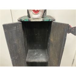 Folk art circus clown cabinet, the the two hinged doors with bow tie decoration opening to reveal fitted shelved interior, the body painted with polka dots and spades, H121cm