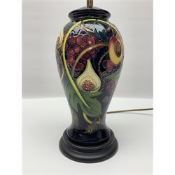 Moorcroft table lamp of baluster form, decorated in the Queens Choice pattern by Emma Bossons, H49cm