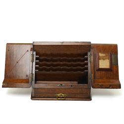 Victorian oak stationery cabinet, the two-door front opening to reveal compartmentalised interior, single drawer to base, H27cm W31cm 