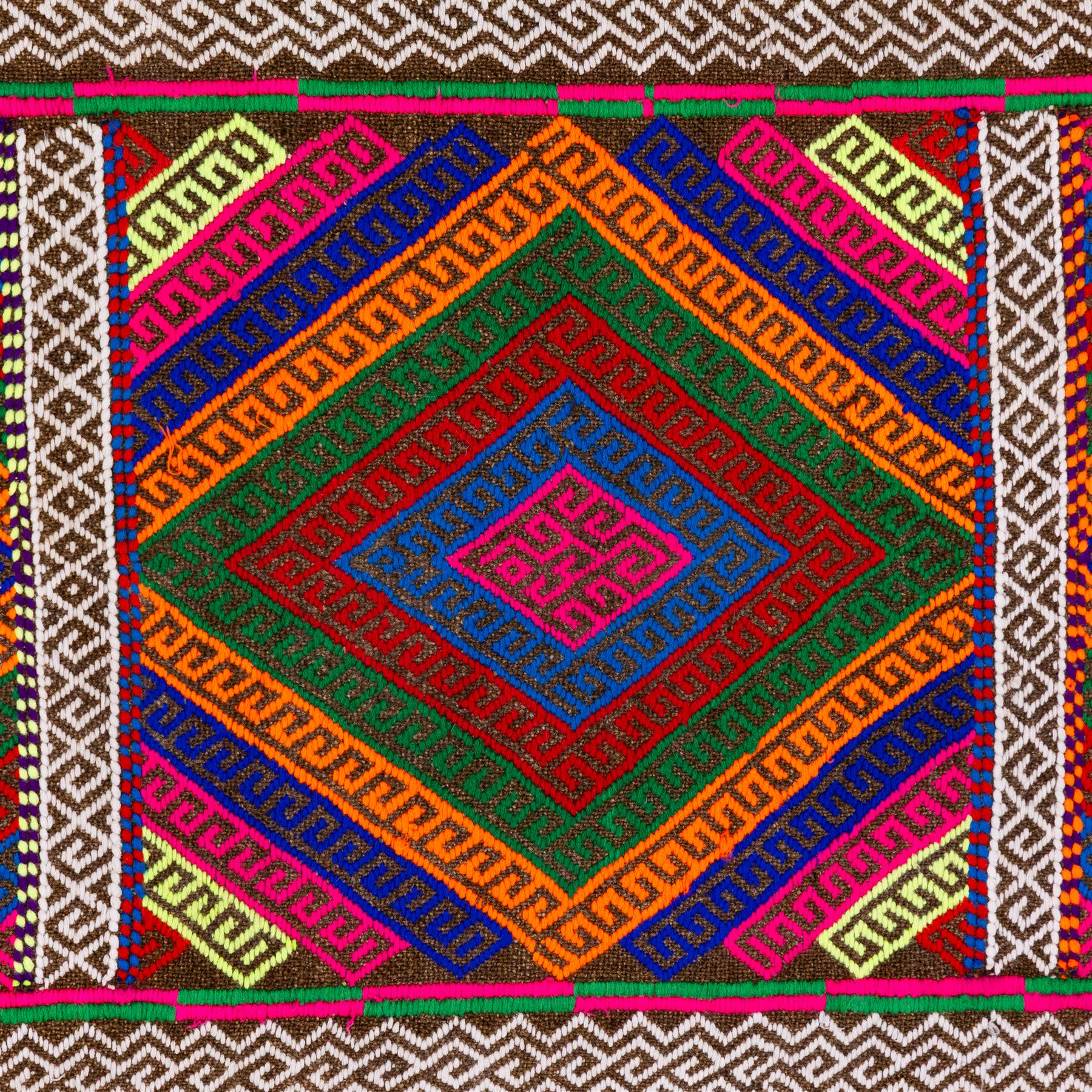 Afghan Suzni flatweave geometric design runner rug, decorated with trailing lozenges decorated with hooked motifs, within zig-zag bands, bright multi-coloured ground ivory and brown geometric main border