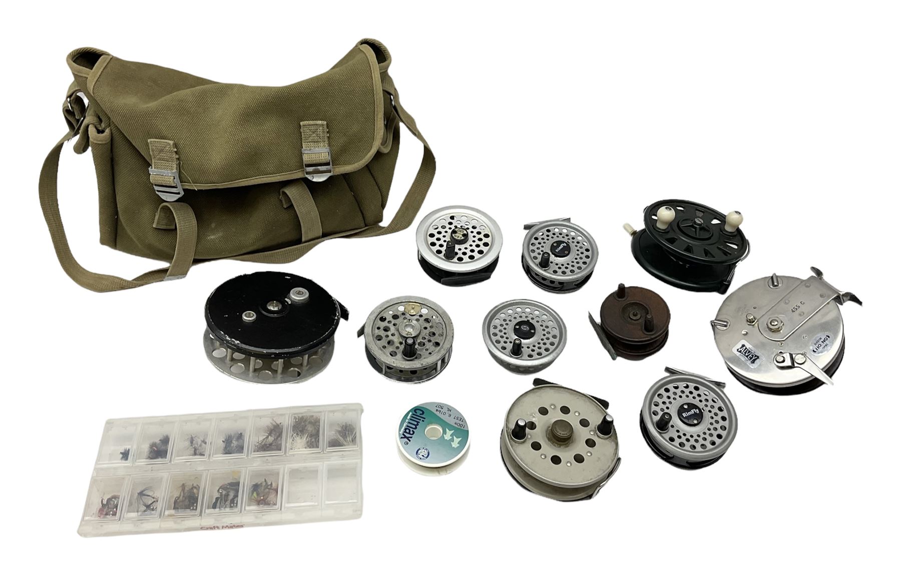 Fishing tackle, including 'The Gnat' fly reel, Alvey 4 1/2 inch reel, Paramount 4 1/2 inch reel, other fishing reels, various fishing flies and other similar items in a carry bag 