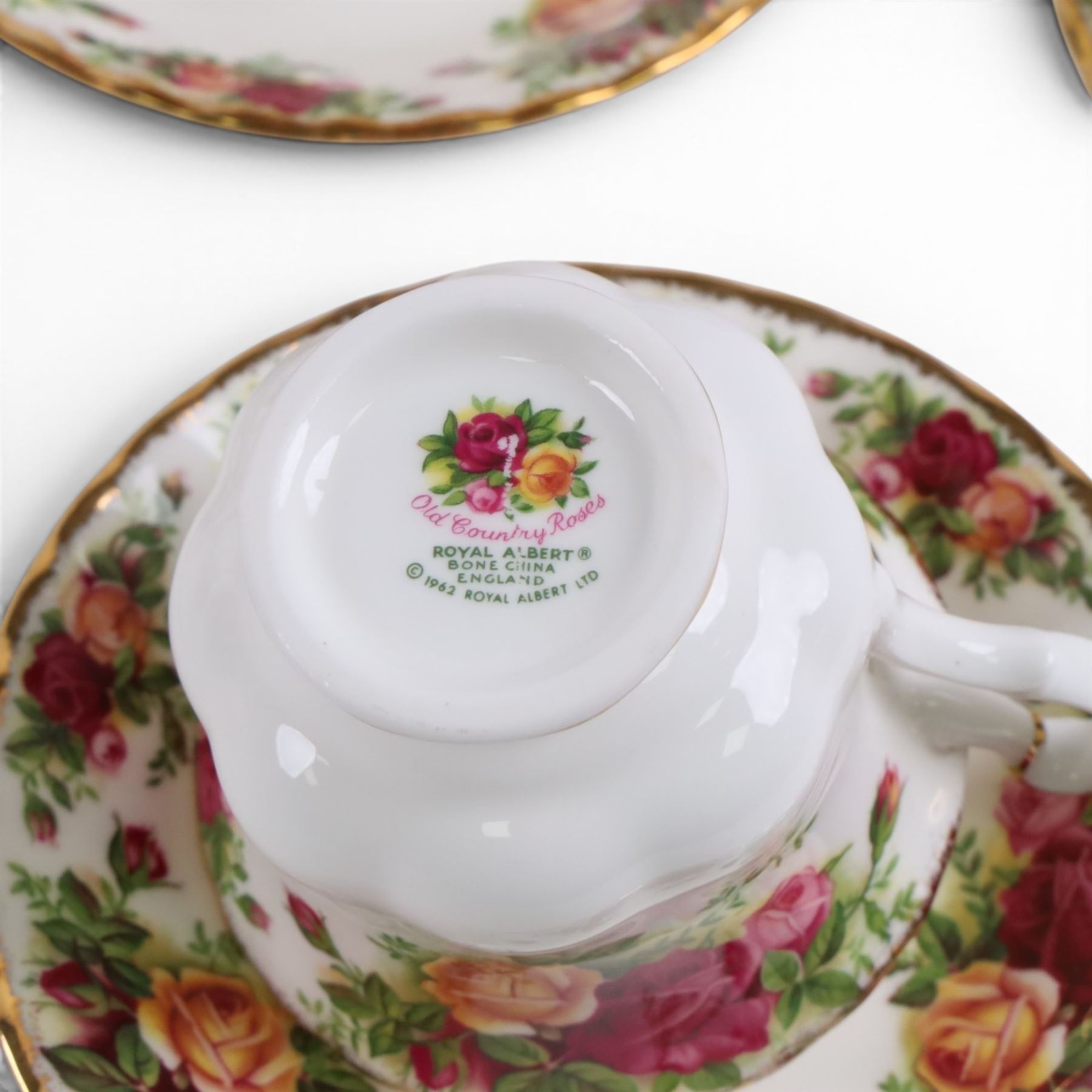 Royal Albert Country Rose tea service for six, comprising teapot, milk jug, covered sucrier, dessert plates, two sandwich plates, cups and saucers 