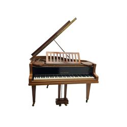  Antonin Petrof - Walnut overstrung baby grand piano, 7 0catve 85 key compass with original strings, tuning pins, damper felts and hammer heads, with roller keyboard action and iron frame, sustaining and una-corda pedals, sliding open lattice music desk, supported on square tapering legs with brass cups and castors, with inner ebonised key fall and ivorine label inscribed 'Supplied by Harrods, London'.