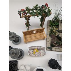 1:12 scale dolls house conservatory and garden accessories, including white wooden glazed conservatory on a stone effect base, black and white metal garden seating, barbecue, plant shelves, parasol, barbeque accessories, large planters, rabbit hutch, animals, chimenea, etc