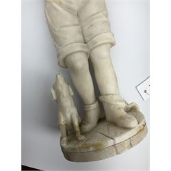 A Victorian alabaster figure modelled as a young boy holding bird, with dog at his feet, H41cm. 