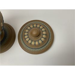 A late 19th century Doulton Lambeth stoneware water filter with original spigot, decorated with relief moulded foliate bands, with impressed marks and monogrammed for Laura Gooderham beneath, H34cm. 