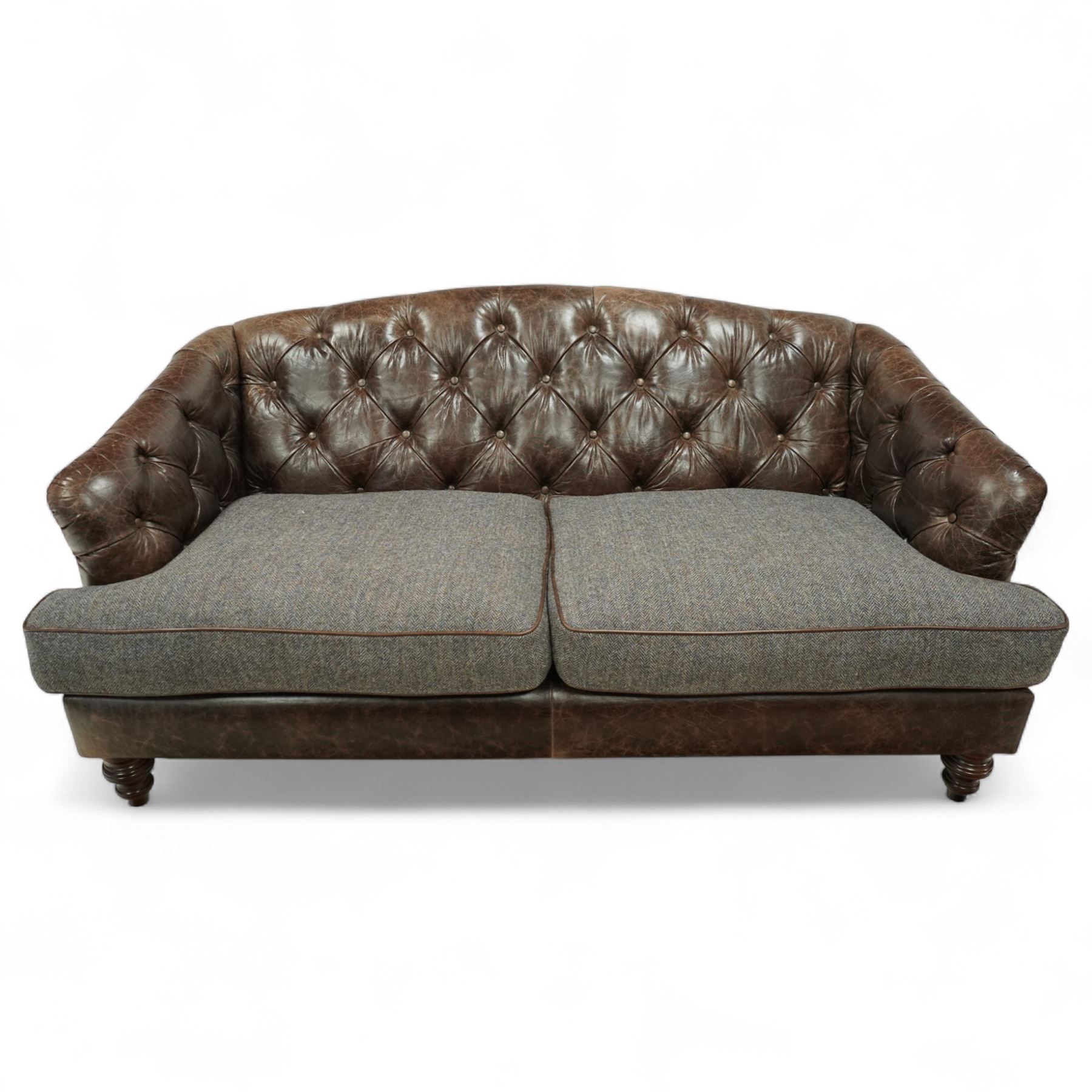 Tetrad - Harris Tweed and leather upholstered Chesterfield sofa, curved back and arms  with deep buttoned brown leather upholstery above loose herringbone tweed seat cushions with brown leather piping, raised on turned wooden feet 