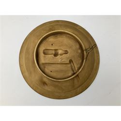 Two oil painted chargers decorated with joyful gentleman, both signed W Stanley, together with a Musterschutz charger decorated in high relief