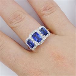 18ct gold sapphire and diamond cluster ring, three emerald cut sapphires, with round brilliant cut diamond surround, hallmarked, total sapphire weight approx 2.25 carat, total diamond weight approx 0.50 carat