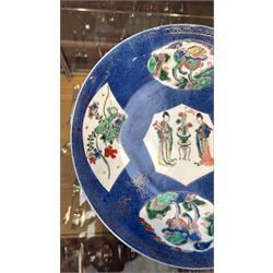 Chinese powder blue ground famille verte charger, possibly Kangxi, decorated with a central cartouche enclosing two female figures, with smaller shaped panels enclosing lions and foliage, square seal mark in blue to base, D28cm