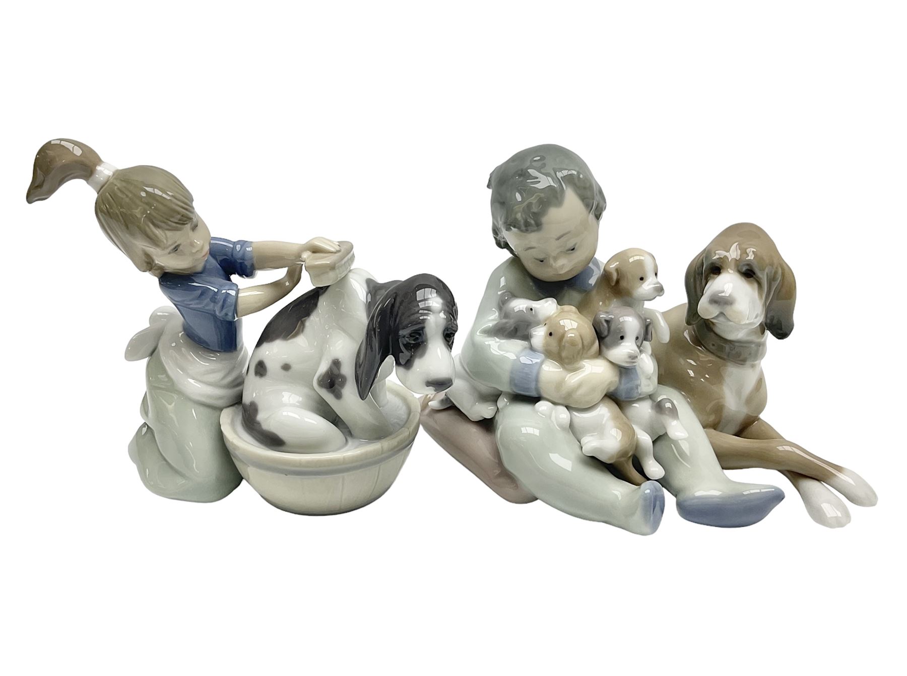 Pair of Lladro figures comprising 'Mis Amigos' model no 5456, and 'Bashful Bather' model no 5455, both with boxes