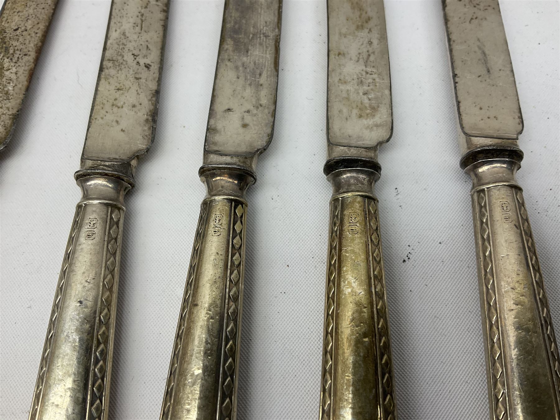 Set of six silver handled butter knives, and a silver handled shoehorn, all hallmarked, but hallmarks worn and indistinct