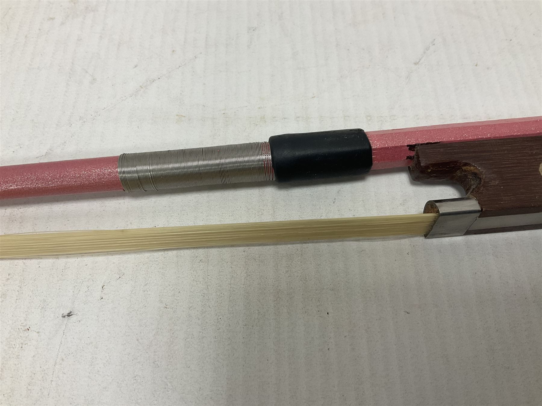 Zest full size pink violin, with a solid wood body and maple head, with matching pink bow and two further bows, in a hard case Length 60cm