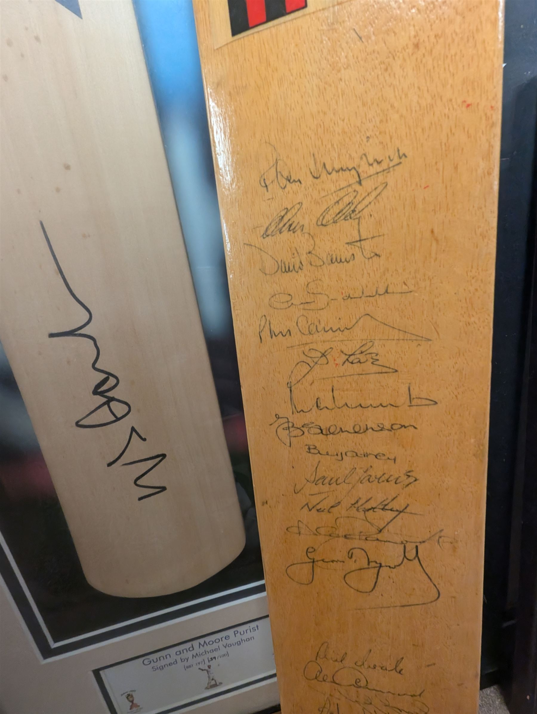 Signed England and Yorkshire cricket memorabilia, including framed bat signed by Michael Vaughn, signed photograph of England team, signed Yorkshire shirt and a signed bat