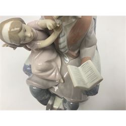 Lladro figure, Fathers Day, modelled as a man reading to his daughter, sculpted by Juan Huerta, in original box, no 5584, year issued 1989, year retired 1996, H22cm