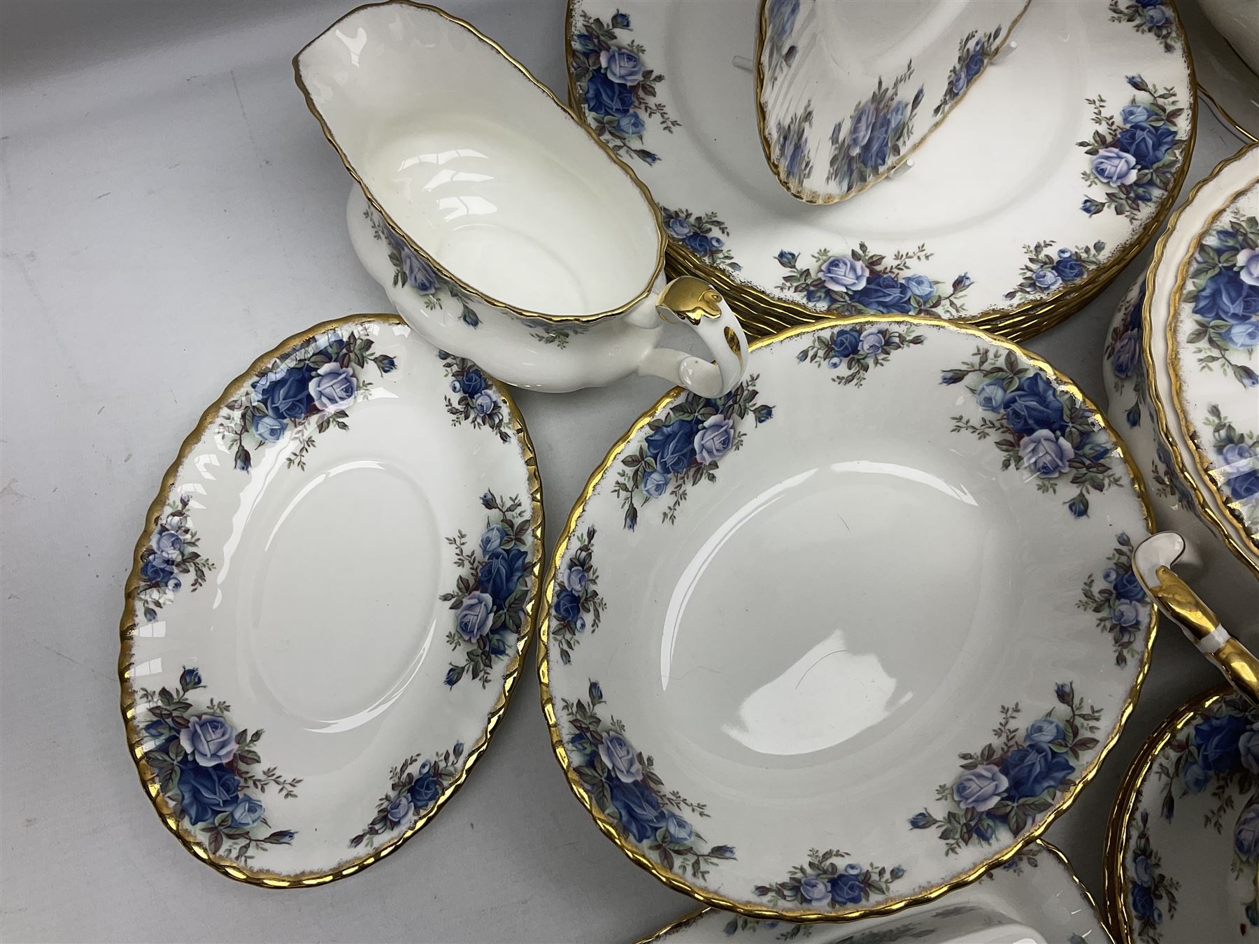 Royal Albert Moonlight Rose pattern dinner service for six, to include, dinner plates, bowls, soup bowls, twin handled soup bowls with saucers, twelve side plates, twin handled soup tureen with cover, twin handled serving dish and cover, sauce boat and saucer, teapot and warmer etc (51)