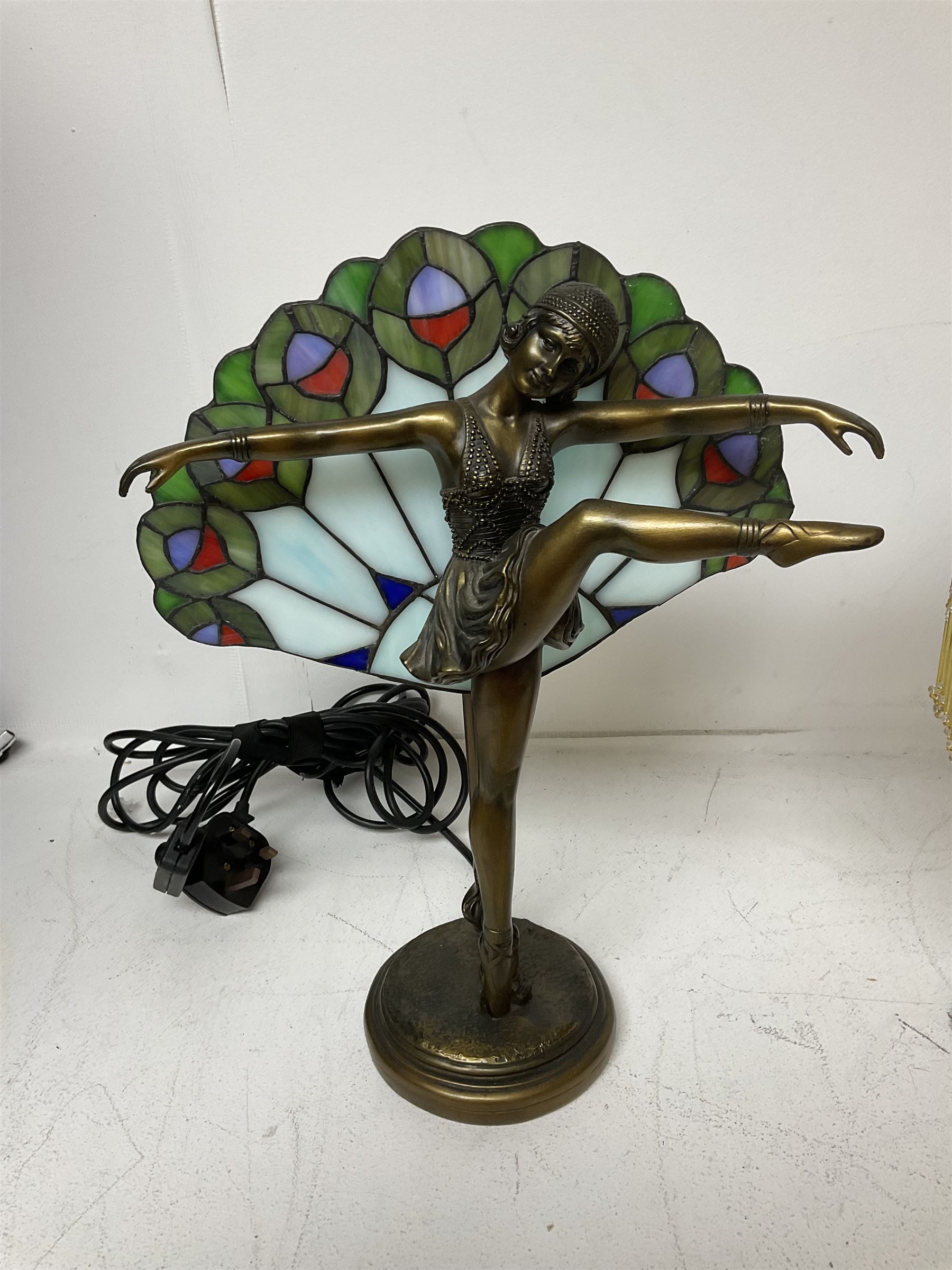 Art Deco Tiffany style table lamp, modelled as a dancer with a fan shaped shade, together with another table lamp with mottled glass and tassel shade, tallest H41cm