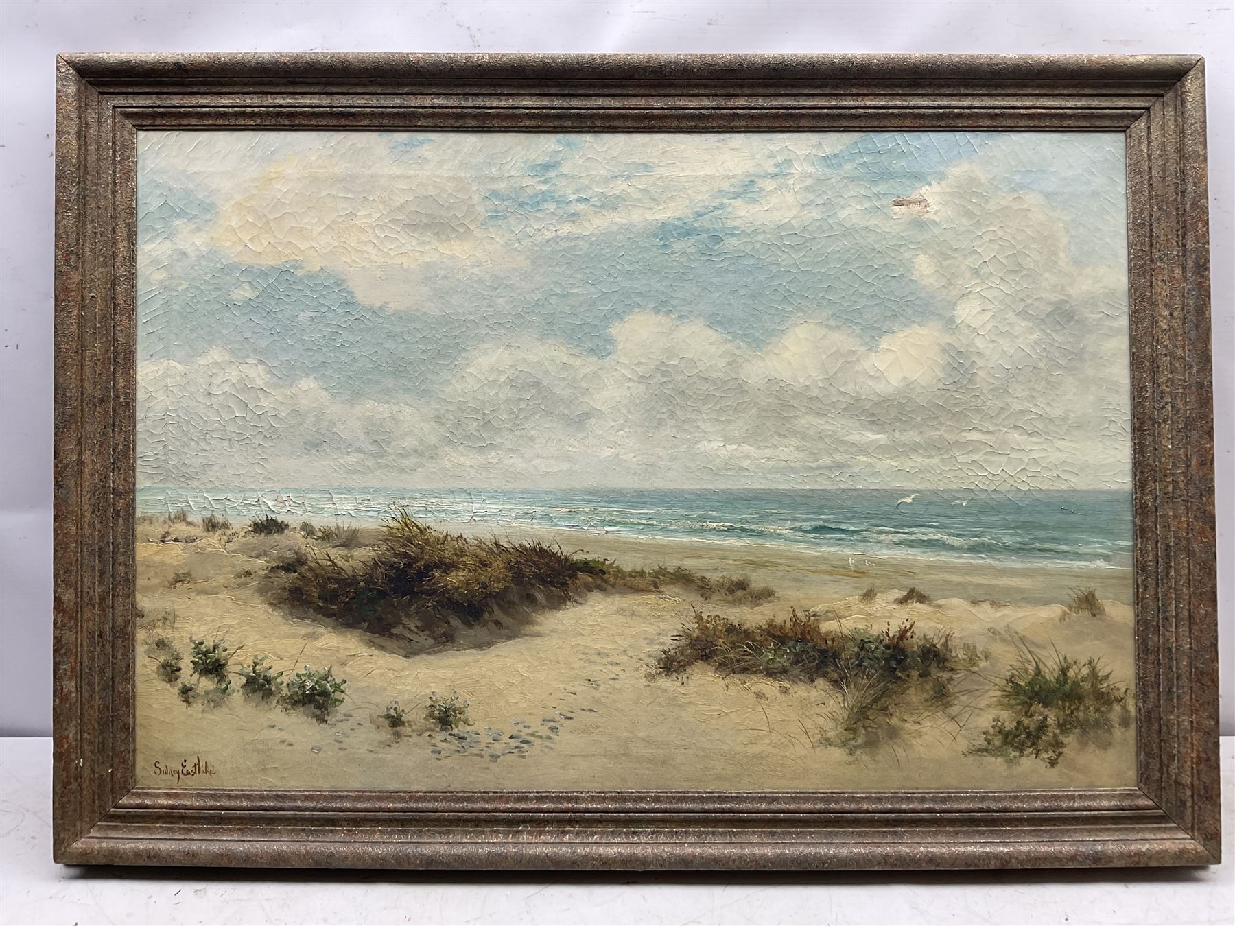 Sidney Eastlake (British 19th/20th century): 'Sand Dunes and Breakers', oil on canvas signed, titled on label verso 60cm x 90cm 
Provenance: with Stacy-Marks Ltd, label verso
