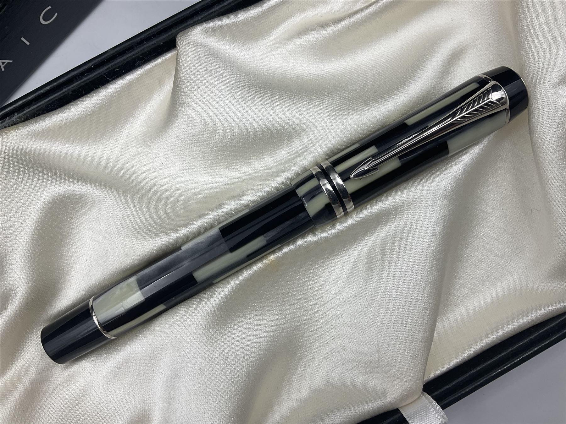Parker Duofold Mosaic special edition fountain pen, issued in 2002, the black, pearl cream and grey cap barrel and cap with double bands and arrow clip, with gold nib stamped 18K 750, housed in original box and outer card packaging with booklet and wiping cloth