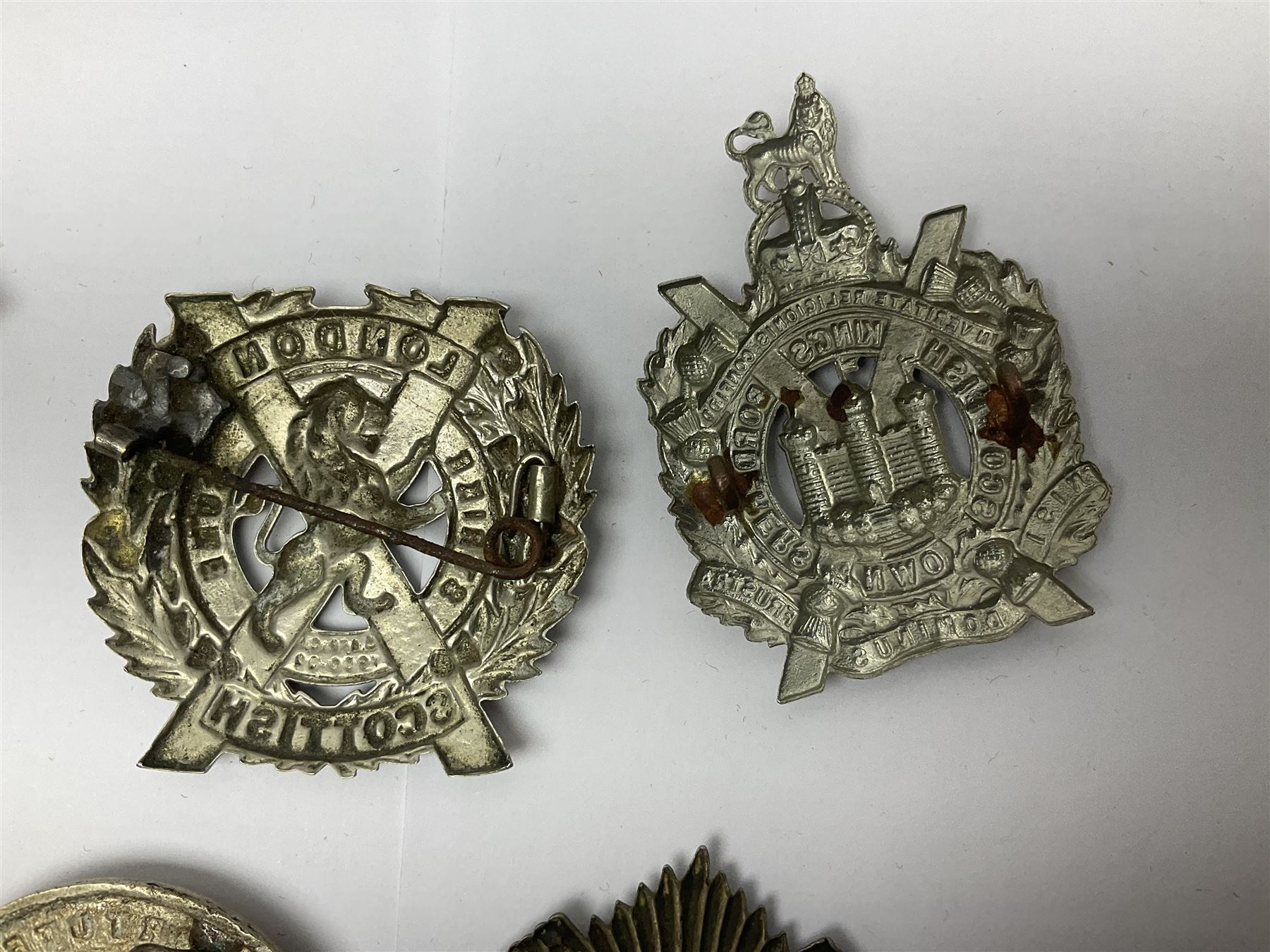Nine Scottish glengarry badges - 6th Fifeshire Volunteer Battalion Black Watch, Lowland Regiment, Highland Regiment, Black Watch, Argyll & Sutherland Highlanders, Kings Own Scottish Borderers, Cameron Highlanders, The Royal Scots and London Scottish (9)