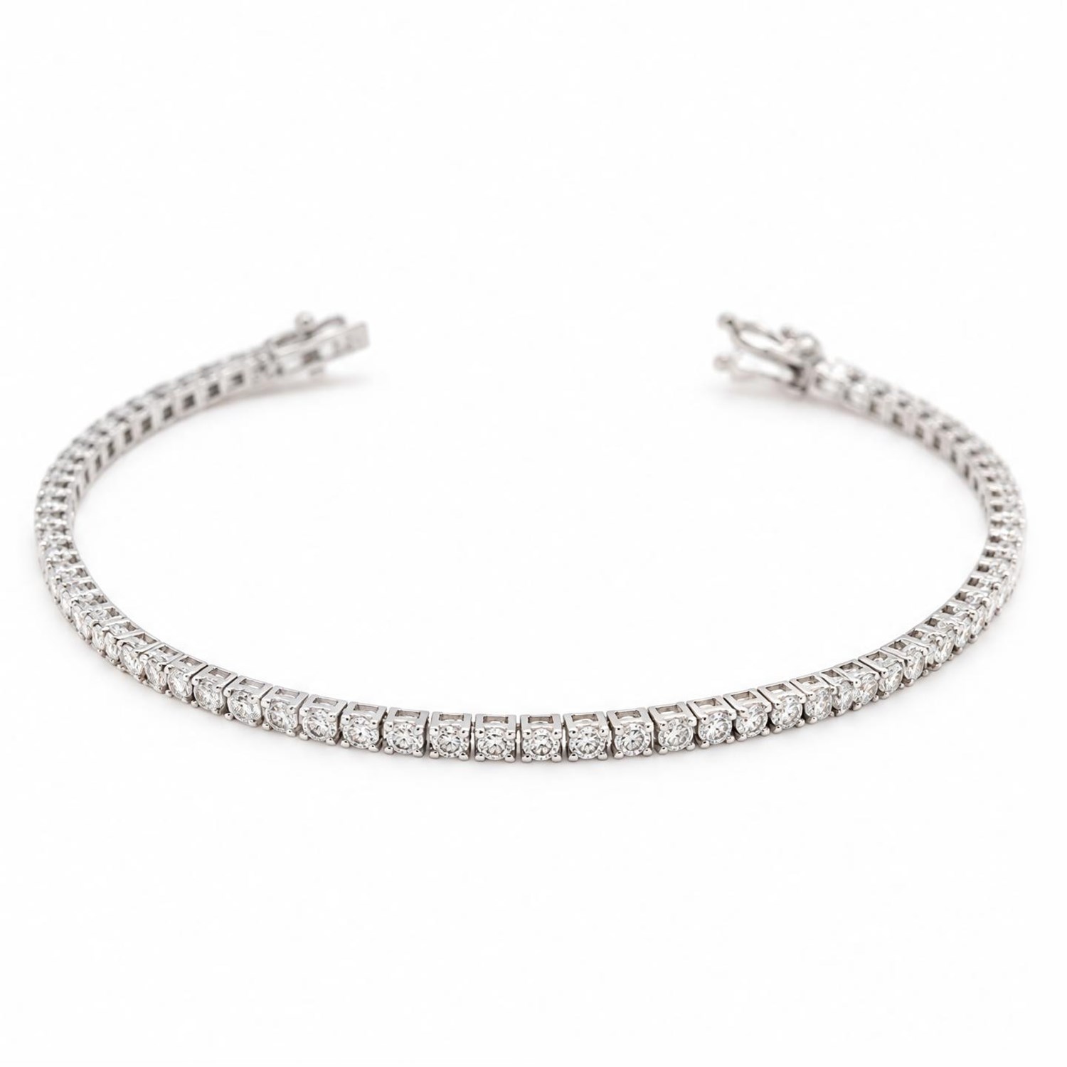 18ct white gold diamond line bracelet, set with seventy-six round brilliant cut diamonds, stamped, total diamond weight approx 2.30 carat