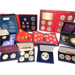  Collection of modern commemorative coins and coin sets including Queen Elizabeth II 'The 2012 Diamond Jubilee 65mm Coin', 'The HRH Prince George Five Crown Coin', '100th Anniversary of the House of Windsor' commemorative collection comprising five medallions, 'Her Majesty's 90 Glorious Years Commemorative Coin & Stamp Set' etc, many being cased with certificates  