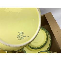 Zeller Fayencerie dinner and tea wares, decorated in cockerels against a yellow ground, with green scalloped border, comprising cake stand, two plates, bowl, three large teacups and saucers, coffee pot, milk jug, cream jug, lidded sugar bowl, pair of cruets modelled as cockerels, butter dish and cover, and utensils pot, and four similar egg cups, in one box 